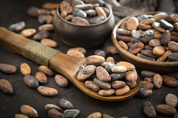 Cocoa beans on old background