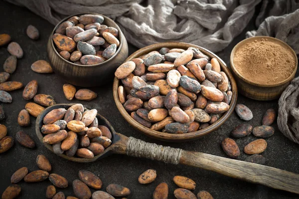 Cocoa beans on old background