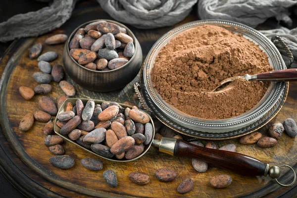 Cocoa beans on old background