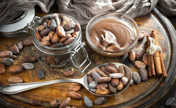 Cocoa beans on old background