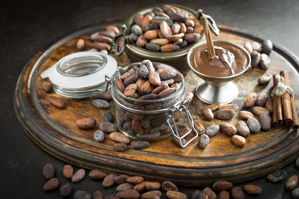 Cocoa beans on old background