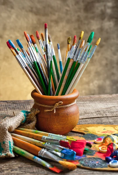 Paints and brushes — Stock Photo, Image