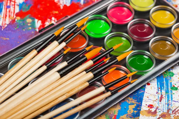 Paints and brushes — Stock Photo, Image