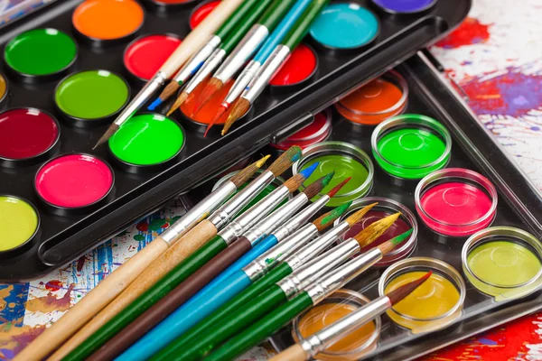 Paints and brushes — Stock Photo, Image