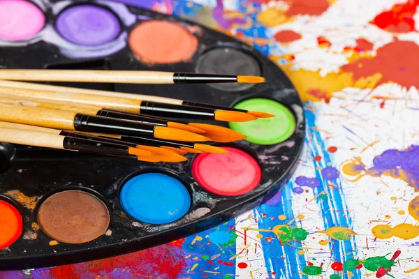 Paints and brushes — Stock Photo, Image