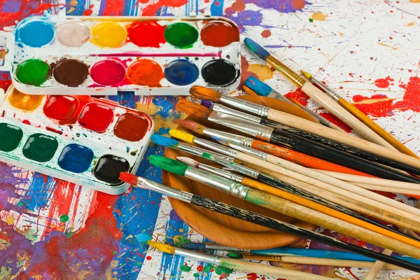 Paints and brushes — Stock Photo, Image