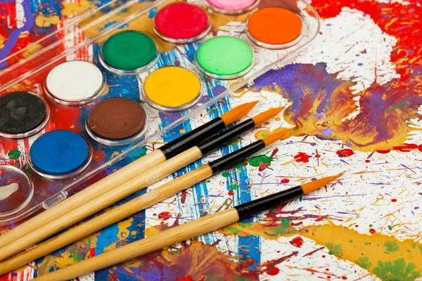 Paints and brushes — Stock Photo, Image