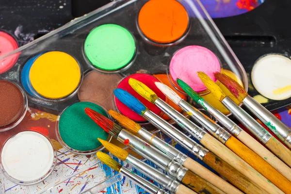 Paints and brushes — Stock Photo, Image