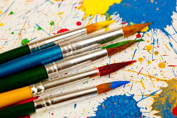 Paints and brushes — Stock Photo, Image