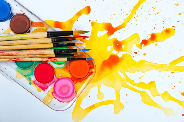 Paints and brushes — Stock Photo, Image