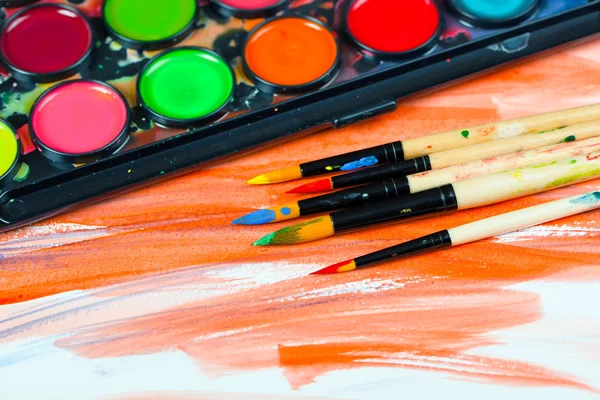 Paints and brushes — Stock Photo, Image