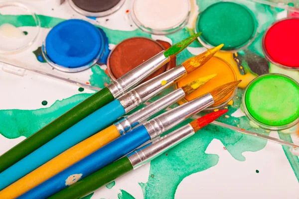 Paints and brushes — Stock Photo, Image