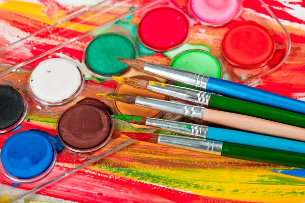 Paints and brushes — Stock Photo, Image