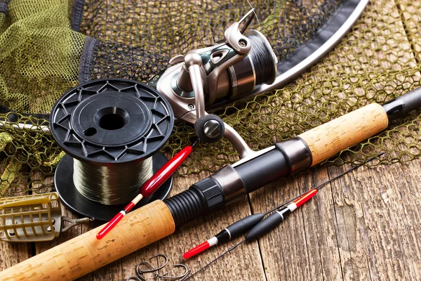 Fishing tackle on a wooden table — Stock Photo, Image