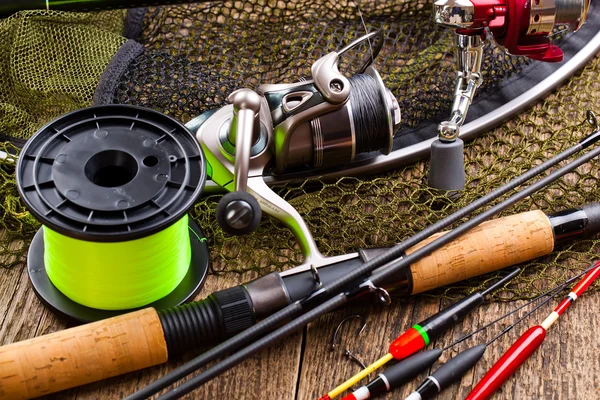Fishing tackle on a wooden table — Stock Photo, Image