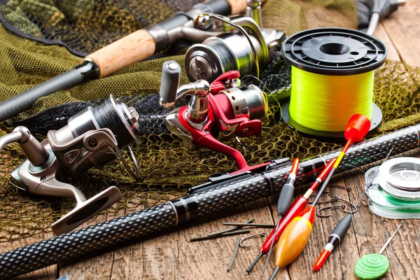 Fishing tackle on a wooden table — Stock Photo, Image