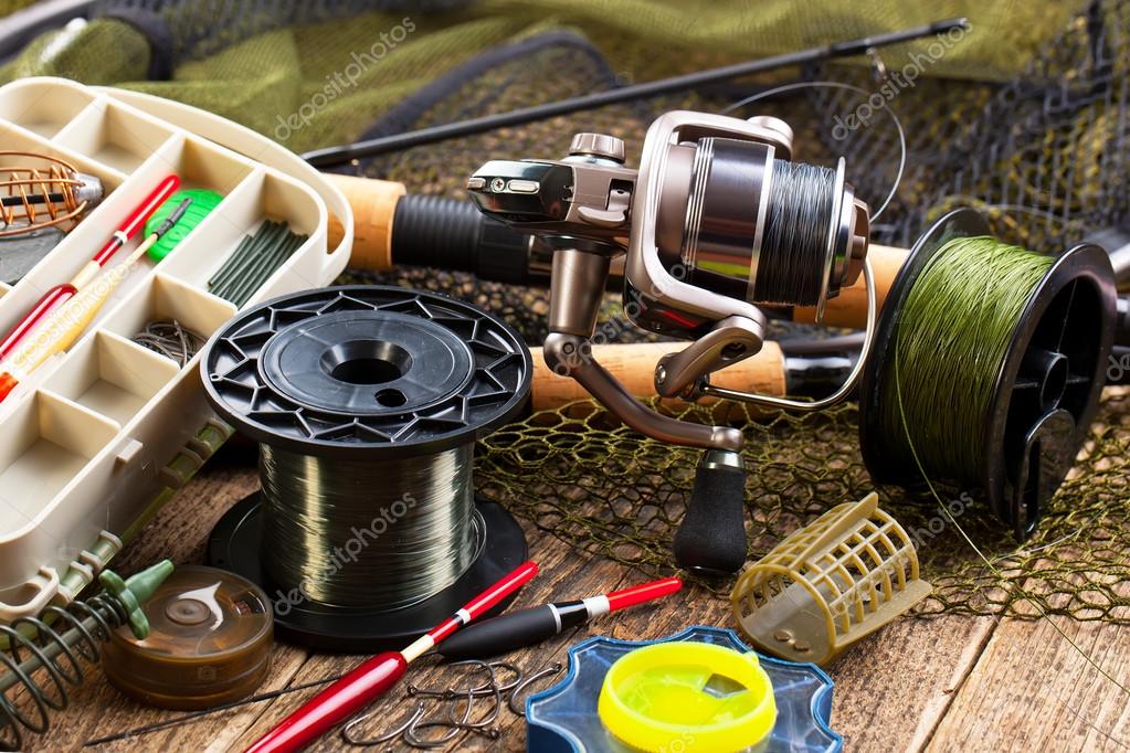 Fishing tackle on a wooden table — Stock Photo © VIZAFOTO #98231880