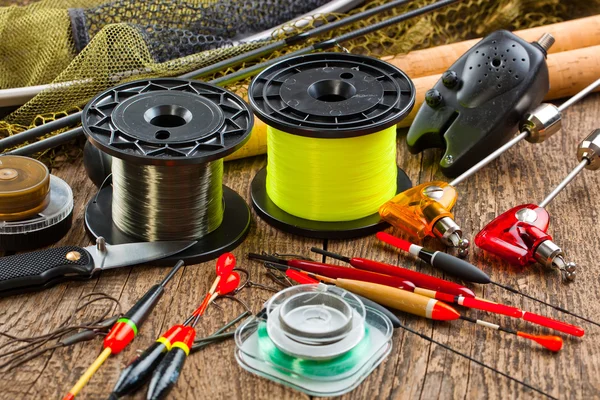 Fishing tackle on a wooden table — Stock Photo, Image