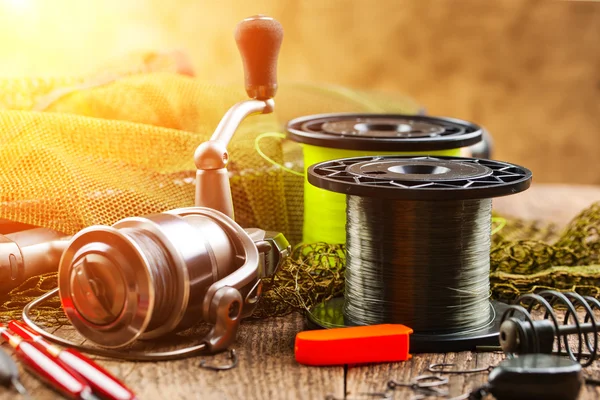 Fishing tackle on a wooden table — Stock Photo, Image