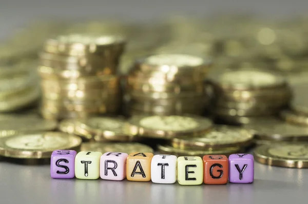 Strategy text and Gold coins — Stock Photo, Image