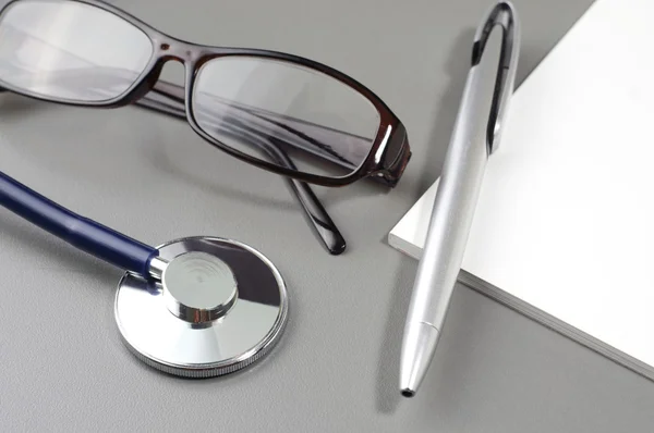 Stethoscope, Eye Glass, Pen and Book Note — Stock Photo, Image