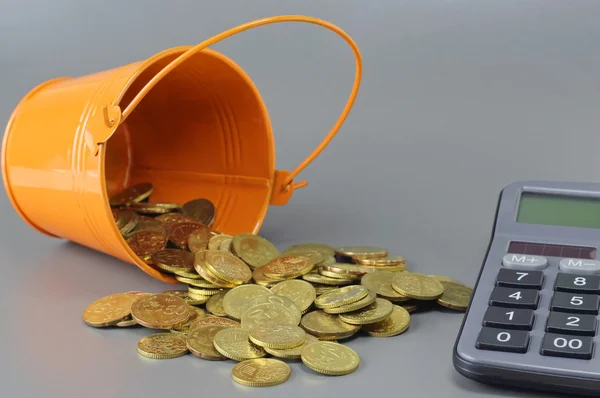 Gold Coins, Calculator and Bucket - Business Concept — Stock Photo, Image