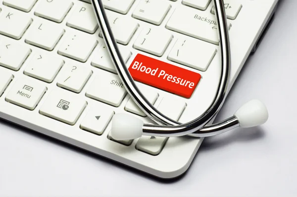 Keyboard, Blood Pressure text and Stethoscope — Stock Photo, Image