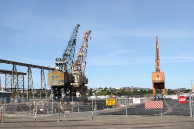 High cranes on abandoned construction site