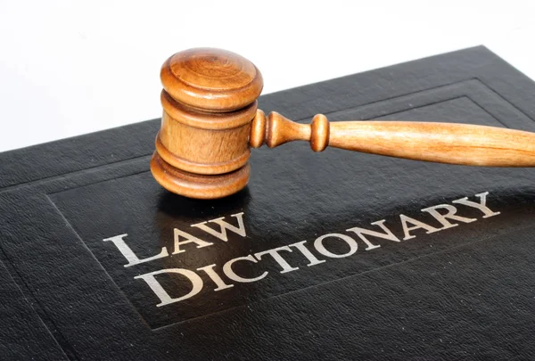 Law dictionary and gavel on white background — Stock Photo, Image