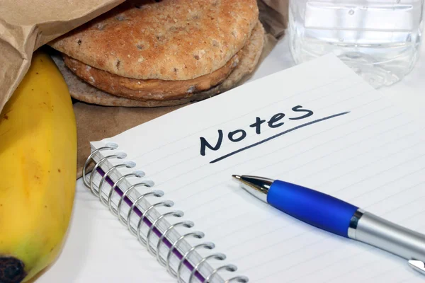 Taking notes during brown bag lunch meeting — Stock Photo, Image