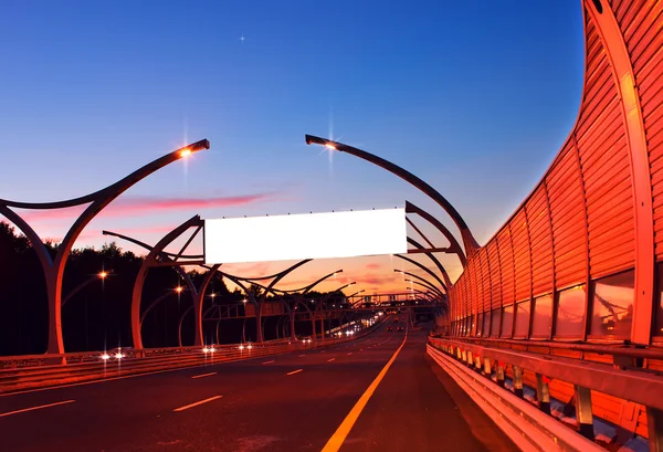 White empty billboard on night highway — Stock Photo, Image