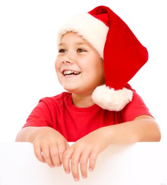 Noel Baba şapkası, küçük kız Pano düzenliyor
