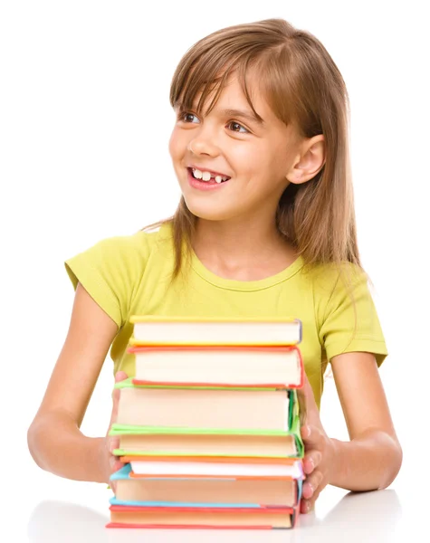 Kleines Mädchen mit ihren Büchern — Stockfoto