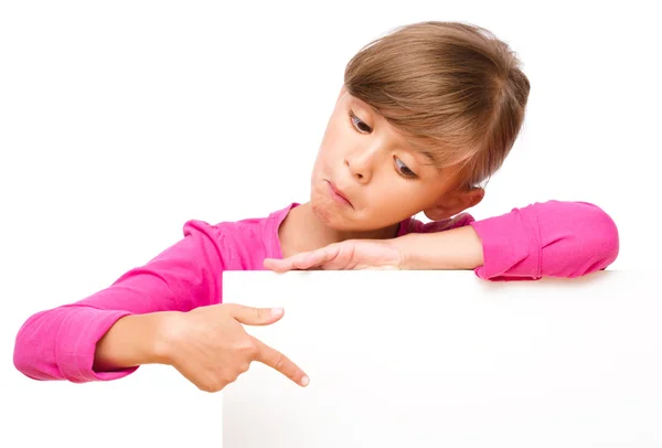 Little girl is looking out from the blank banner — Stock Photo, Image