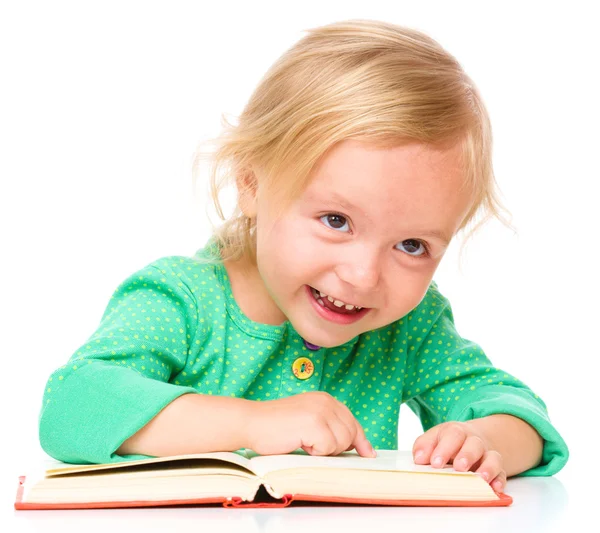 Little girl is reading her book — Stock Photo, Image