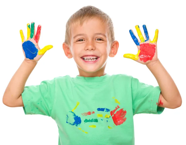 Portrait of a cute boy playing with paints — Stock Photo, Image