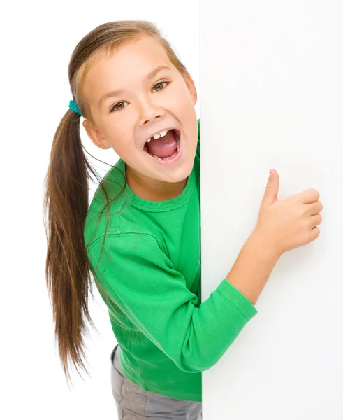 Little girl is looking from out blank board — Stock Photo, Image