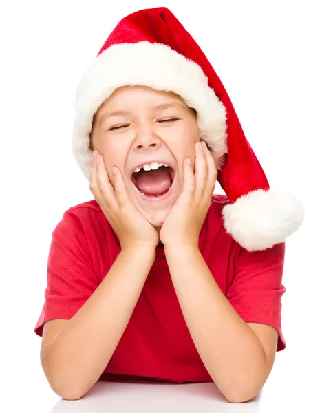 Menina em Papai Noel está sonhando acordado — Fotografia de Stock
