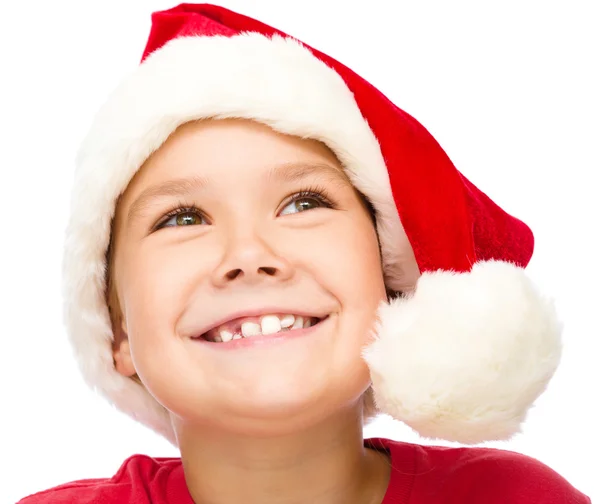 Bambina col cappello da Babbo Natale sta sognando ad occhi aperti — Foto Stock