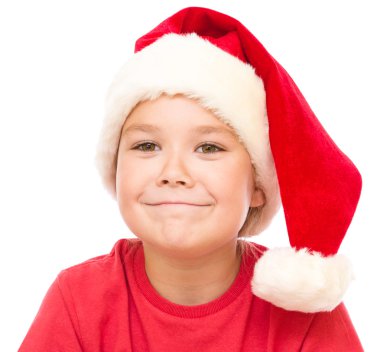 Noel Baba şapkası, sevimli küçük bir kız portresi