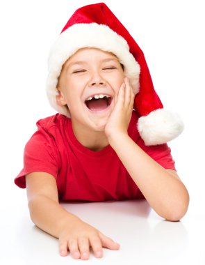 Noel Baba şapkası, küçük kız gülerek