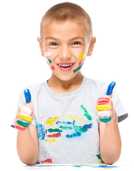 Portrait of a cute boy playing with paints — Stock Photo, Image