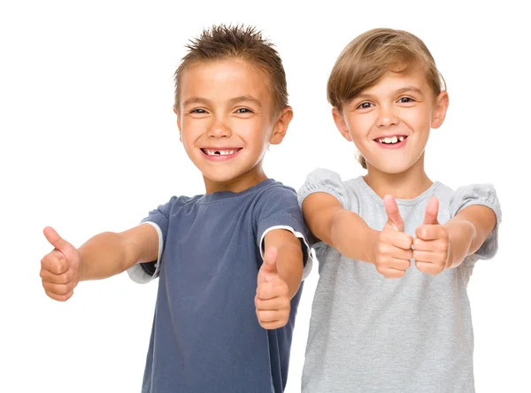 Little boy and girl are showing thumb up sign — Stock Photo, Image