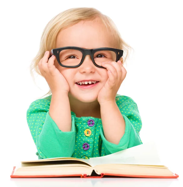 Little girl is reading her book — Stock Photo, Image