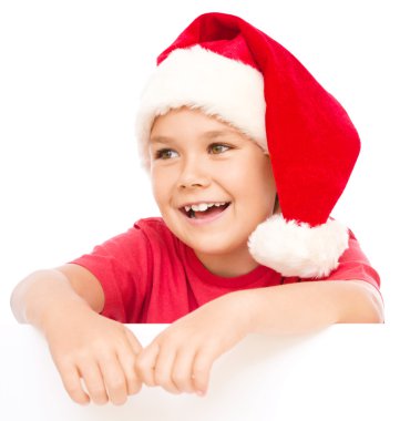 Noel Baba şapkası, küçük kız Pano düzenliyor