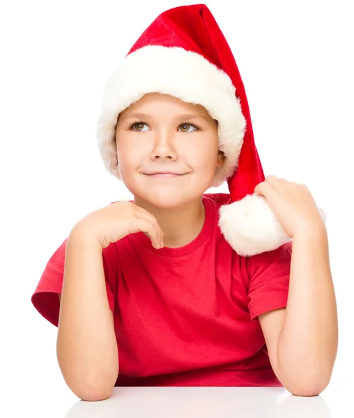 Portrait d'une jolie petite fille en chapeau de Père Noël — Photo