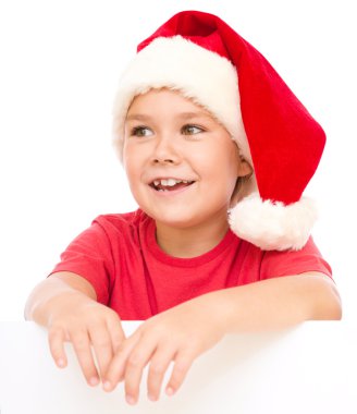 Noel Baba şapkası, küçük kız Pano düzenliyor
