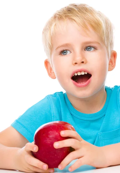 Portrait of a cute little boy with red apple — Stock Photo, Image