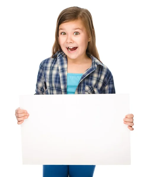 Little girl is holding a blank banner — Stock Photo, Image