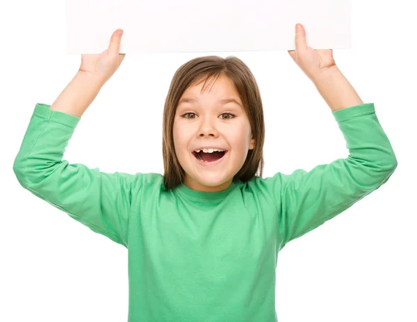 Little girl is holding a blank banner — Stock Photo, Image